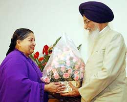 Chief Minister of Tamil Nadu Jayalalithaa presents a bouquet to Mr Surjit Singh Barnala soon after he was sworn in as the new Governor of the state in Chennai