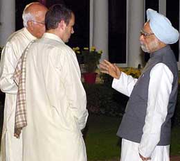 Dr Manmohan Singh talks to former Chief Minister Farooq Abdullah and his son Omar Abdullah during the Iftar party which is being hosted by the Prime Minister at 7, Race Course, in New Delhi on Wednesday.