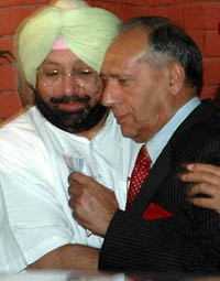 Captain Amarinder Singh gives an emotional farewell to outgoing Punjab Governor Justice O.P. Verma (retd) at the Raj Bhavan, Chandigarh, on Wednesday. 
