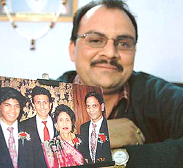 Bobby Jindals cousin, Ashok Jindal, shows a family photo in Chandigarh on Thursday.