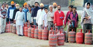 A long queue of LPG consumers in front of a dealers office in Ludhiana on Thursday