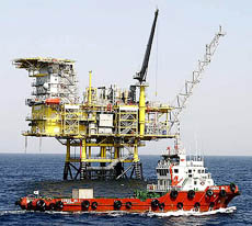 A boat sails past a gas-drilling rig of Donghae-1, 60 km off the southeastern city of Ulsan. South Korea began commercial production on Friday at its first gas field, which is capable of producing 40,000 tonnes of gas annually, or 2.2 per cent of the countrys total consumption, and has a reserve of five million tonnes.