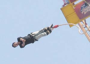 A boy enjoying the excitement of bungee jumping, organised by Xtreme Zone in Noida