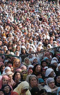 Women offer prayers at the Hazratbal shrine on the third Friday of the holy month of Ramzan in Srinagar
