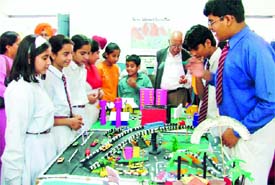 Students explain their models to visitors at an exhibition held in Ludhiana