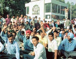 Members of the Punjabi University Students Confedration block gate of the university in Patiala on Friday. 