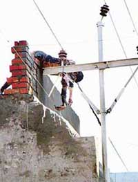 The body of Paramjit Kumar, alias Pammi, a property dealer, lies on an 11KV electricity line and parapet of his house at Bhabhat village, near Zirakpur