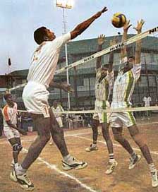 A spiker of HSIDC, Panchkula, jumps to save a shot from players of SAI, Kurukshetra, in Ist Sunil Memorial Volleyball Meet at Shivalik Public School, Sector 41, Chandigarh