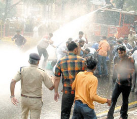 Police used water cannons to disperse the BJP activists, demonstrating against the hike in price of petroleum products at Parliament Street in the Capital on Saturday.