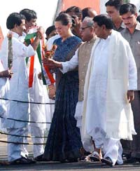 Congress President Sonia Gandhi with Defence Minister Pranab Mukherjee and Water Resources Minister P.R. Das Munshi on her arrival at Kolkata Airport on Saturday. 