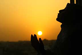 A girl prays for the speedy recovery of Palestinian President Yasser Arafat 