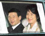 Japan's Crown Princess Masako, right, and her husband Crown Prince Naruhito arrive at Imperial Palace