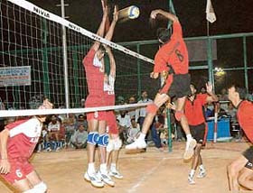ONGC volleyball player smashes the ball in the final of the Northern India Sunil Memorial Volleyball Meet against the HSIDC at Shivalik Public School, Sector 41, Chandigarh