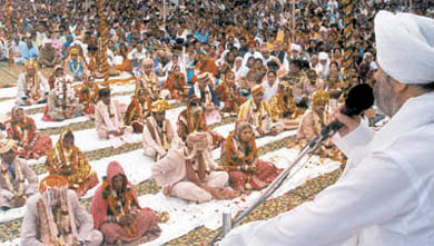 Couples getting married at a mass marriage function, organised by Sant Nirankari Mission in the Capital.