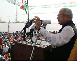 Haryana Congress President Bhajan Lal addresses a rally at Satrod Kalan village, near Hisar cantonment, on Sunday. 