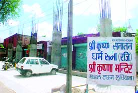 Pillars erected outside the main entrance to Krishna Mandir, Model Town, Ludhiana, for extending the temple premises in violation of the building by-laws