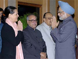 Prime Minister Manmohan Singh greets Congress President Sonia Gandhi as Defence Minister Pranab Mukherjee looks on, prior to his departure to The Hague, Netherlands, for the 5th India-EU summit in New Delhi on Sunday.