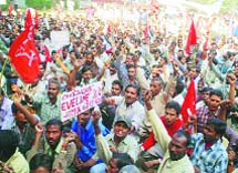 Industrial workers protest against harassment and violation of labour laws by industrial units, at the Mini Secretariat in Ludhiana