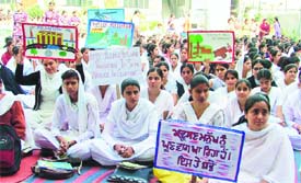 Students of Master Tara Singh College hold an anti-pollution rally in the college on Monday