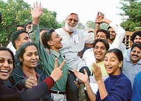 Students and faculty members of the Government College of Arts, Sector 10, Chandigarh, lift the Principal, Mr Braham Prakash, after Panjab University granted permission for starting a course on Tuesday. 