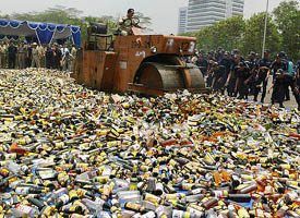 Indonesian government officials destroy alcoholic drinks