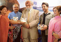 Mr K.P.S. Gill and artistes Manjeet Maan, Gurdas Maan and Divya Dutta at the release of the music of the movie, Des Hoya Pardes, at a hotel in Chandigarh on Wednesday. 