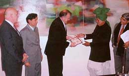 Haryana Chief Minister Om Prakash Chautala being presented a souvenir by BMW Senior Vice-President Klaus Berning at the companys headquarters at Munich on Thursday.