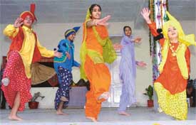 Students of St Peters Secondary School, Sector 37, Chandigarh, perform the bhangra during the Divali celebrations