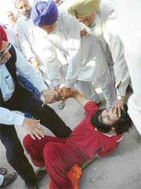 Members of the Kisan Hit Bachao Committee beat up a passer-by in Mohali on Friday