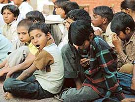 Slum children from Sector 25 strike a lazy pose as they attend an informal session on child rights organised by the Theatre Age at Government High School, Sector 24 Chandigarh