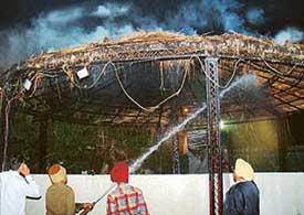 Fire brigade employees douse the flames at the Mohali Club, Phase XI, Mohali, on Saturday
