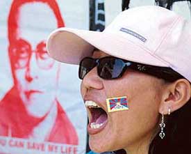 A member of the Regional Tibetan Youth Congress raises slogan against China, demanding the release of Tulku Tenzin Delek, at Sector 17, Chandigarh