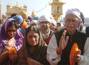 Mr L.K. Advani, president of the BJP, along with his family members coming out of the Golden Temple after paying obeisance at Amritsar on Sunday.