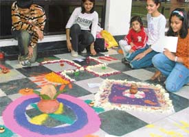 Visitors admire rangoli designs at the Sutlej Club in Ludhiana