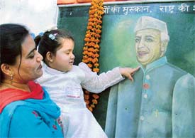 A visitor and her child at the philatelic exhibition organised at Lions Bhavan, Ludhiana, on Childrens Day on Sunday