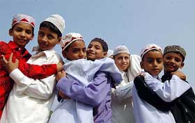 Children greet each other following Id prayers at Patna's Gandhi Maidan on Sunday