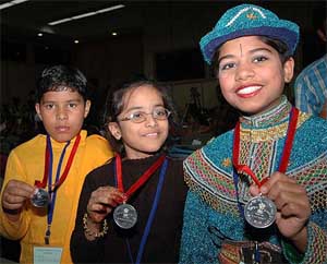 Some of the recipients of National Child Award show their medals in New Delhi on Sunday