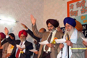 Giani Joginder Singh Vedanti, Jathedar, Akal Takht, administers an oath to participants at a state-level convention on female foeticide in Bathinda on Sunday.