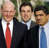 Infosys Chief Executive Nandan Nilekani speaks with Microsoft Chief Executive Steve Ballmer as Microsoft Corporation Regional Vice-President Asia-Pacific Eduardo Rosini looks on as they walk through the Infosys campus in Bangalore on Monday 