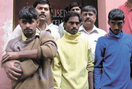 The burglars in police custody in the Capital. 
