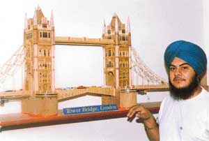 Baldev Singh Saggu with his model of Tower Bridge, London