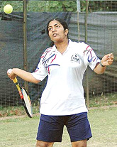 Chetna of NTR University of Health Science, Vijayawada, returns a shot during all-India university women tennis tournament in Chandigarh on Wednesday.