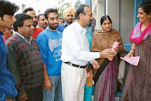 Mr O.P. Verma a candidate for Municipal Corporation Ward No 11 by- election meets voters in Sector 20, Chandigarh, on Wednesday.
