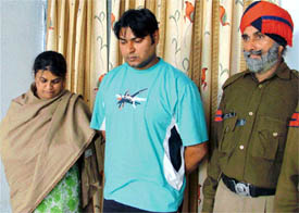 Accused Harjit Kaur and Paramjeet Singh who were arrested for duping 30 persons
