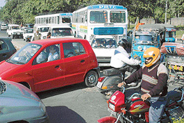 Traffic on the Chandigarh- Ambale highway was hit due to repair of road in Sector 29, Chandigarh on Thursday. 