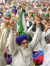 Farmers from Punjab stage a dharna to start a movement, Save Land-Save Respect, at Jantar Mantar in New Delhi on Thursday. 
