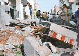 Rubble after the demolition carried out by the Municipal Corporation in Sector 10, Panchkula, on Friday.
