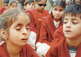A student of Institute for the Blind, Sector 26, sings during the Childrens Day celebrations at the institute in Chandigarh on Saturday. 