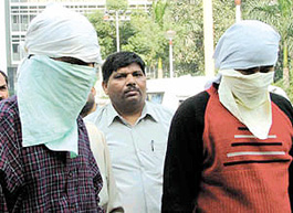 Accused Ravinder Singh Dahiya and Manish Yadav in the police custody in the Capital on Saturday. 