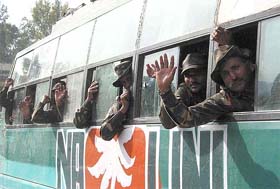 Soldiers wave from a bus in Sunderbani, near Jammu